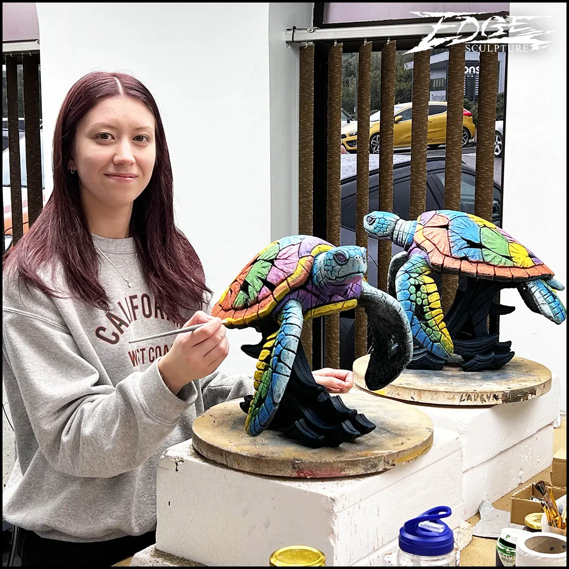 Holly painting a reef sea turtle
