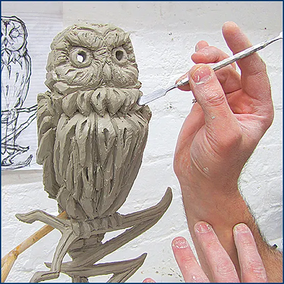 Picture of an Owl sculpture in clay