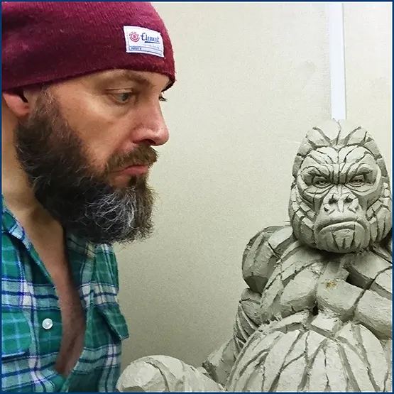 Matt Buckley with a sitting Silverback Mountain Gorilla in clay