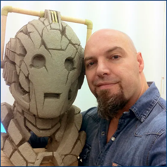 Matt Buckley with a BBC, Doctor Who Cyberman sculpture in clay